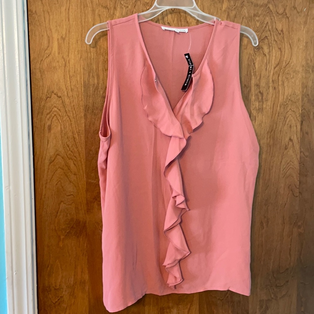 Light pink ruffled blouse
